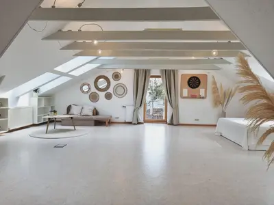 a large white room with a bed and a table at Old Town Jiva apartment in Kaunas