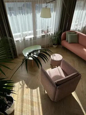 a living room with a couch and a chair at The Most Central Apartment in Kaunas