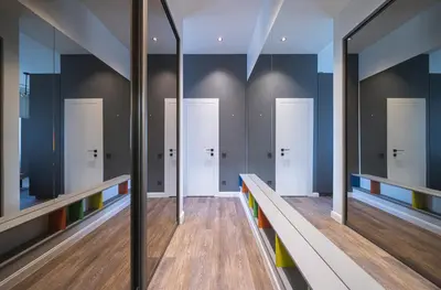 a row of doors in a bowling alley at Jasinskio Apartament - Lollo Stay in Vilnius