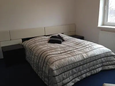 a bedroom with a bed with a pillow on it at Luka in Marijampolė