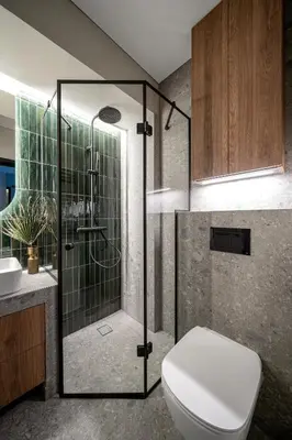 a bathroom with a shower with a toilet and a sink at Cosy Panoramic Studio in the center for 1-2 pers. in Kaunas