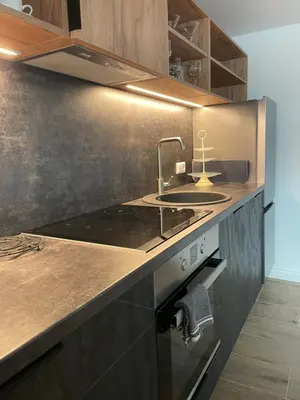 a kitchen with a sink and a stove at Kęstučio 55 in Kaunas