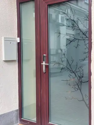 a glass door with a picture of a tree on it at Kęstučio 55 in Kaunas