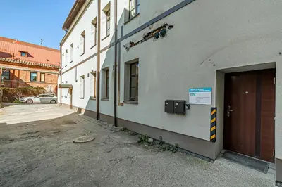 a building with a door on the side of it at Grand Apt with air conditioning in Kaunas