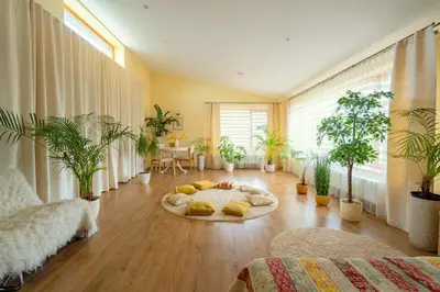 a living room with a bunch of potted plants at Cozy house in Vilnius in Vilnius