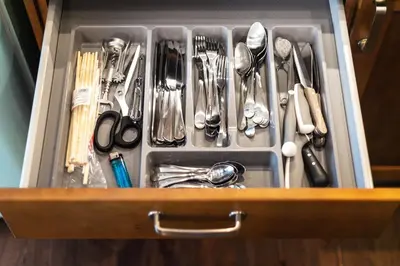 a drawer filled with utensils and utensils at 3 Bedroom Duplex Apartment next to the Gates of Dawn in Vilnius