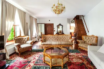a living room with couches and a coffee table at Classic Old Town Apartment next to the Gates of Dawn in Vilnius