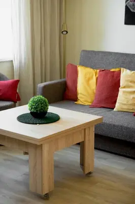 a living room with a coffee table and a couch at Old Town Apartment in Vilnius