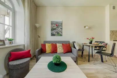 a living room with a couch and a table at Old Town Apartment in Vilnius