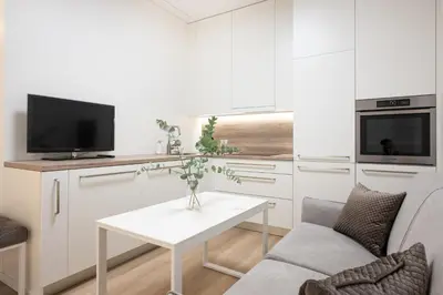a living room with a couch and a table at Cathedral apartment, perfect for couples in Vilnius