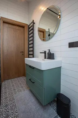 a bathroom with a sink and a mirror at M8 Exclusive Studio Apartment in Kaunas