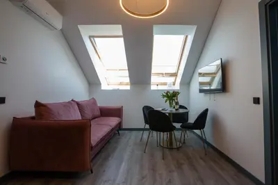 a living room with a couch and a table at M8 Stylish One-Bedroom Apartment in Kaunas