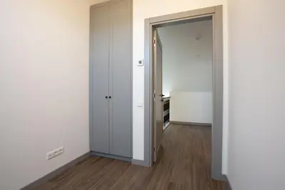 an empty room with white walls and a door at M8 Modern Two-Floor Apartment in Kaunas