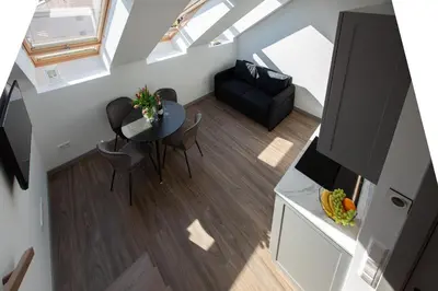 an overhead view of a living room with a table and a couch at M8 Modern Two-Floor Apartment in Kaunas