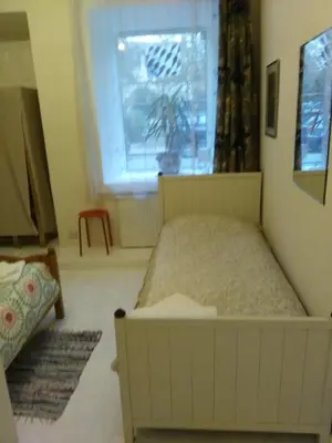 a bedroom with a bed and a window at Dora Apartment Užupis in Vilnius