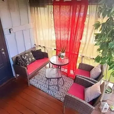 a living room with two couches and a table at DAGNA summer house in Šunupis
