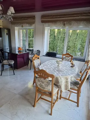 a dining room with a table and chairs at Druskininkai Algida in Druskininkai