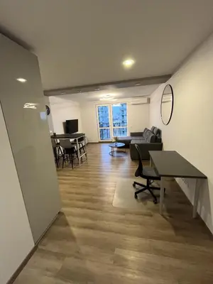 an empty room with tables and chairs in a building at Lovely Flat with Great Central Location Vilnius in Vilnius