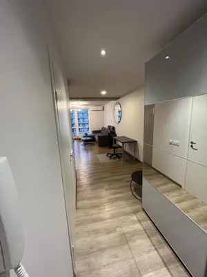a room with a hallway with a desk and a living room at Lovely Flat with Great Central Location Vilnius in Vilnius