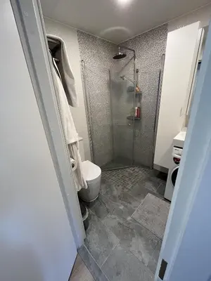 a bathroom with a shower and a toilet at Lovely Flat with Great Central Location Vilnius in Vilnius