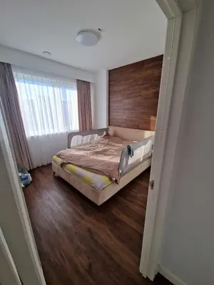 a bedroom with a bed with a wooden floor and a window at Entire House for a company of Friends in Kaunas