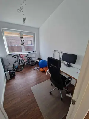 a room with a desk with a computer and a chair at Entire House for a company of Friends in Kaunas