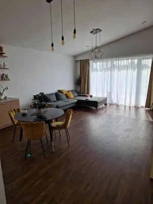 a living room with a couch and a table and chairs at Entire House for a company of Friends in Kaunas