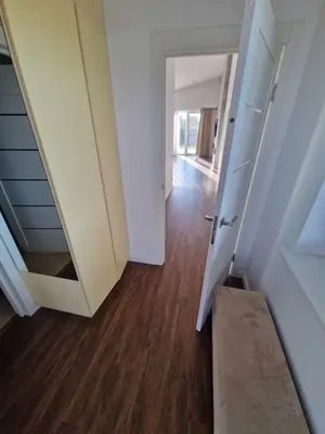 a hallway with an open door and a stair case at Entire House for a company of Friends in Kaunas