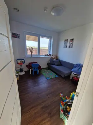 a living room with a blue couch in a room at Entire House for a company of Friends in Kaunas