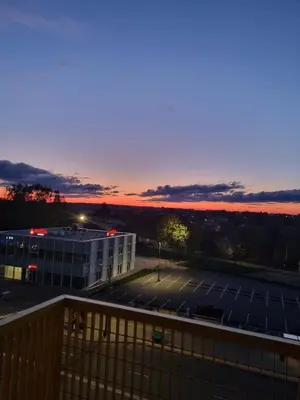a view of a parking lot at sunset at Cozy Loft in Kaunas