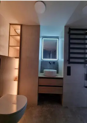 a bathroom with a sink and a window at Cozy Loft in Kaunas