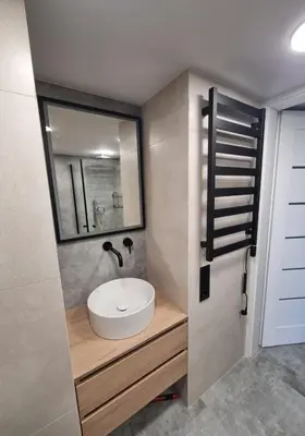 a bathroom with a sink and a mirror at Cozy Loft in Kaunas