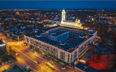 an overhead view of a large building with a clock tower at Cozy Loft in Kaunas