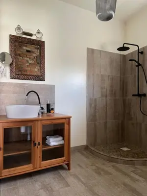 a bathroom with a sink and a shower at Namas senamiestyje in Kėdainiai