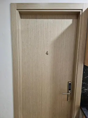 a wooden door with the number four on it at Kauno apartamentai in Kaunas