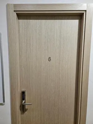 a wooden door with the number six on it at Kauno apartamentai su balkonu in Kaunas