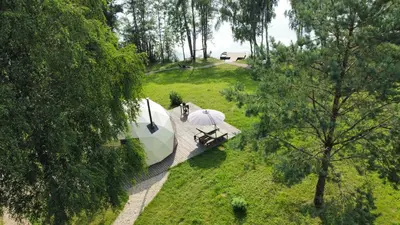 an aerial view of a tent in a field with trees at Glamping Zarasai in Palivarkas