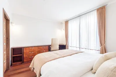 a bedroom with a large bed and a window at Central Apartment in Gedimino Av by URBAN RENT in Vilnius