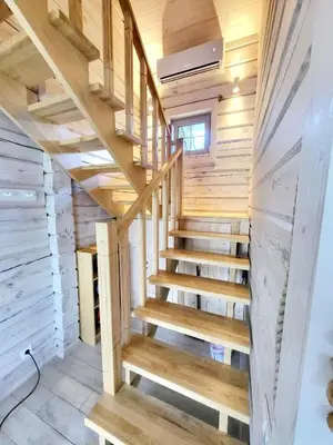 a staircase in a tiny house at GREY PINE HOUSE in Druskininkai