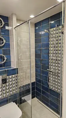 a bathroom with a shower and a toilet at Modern Studio Apartment in Marijampolė