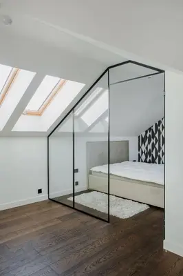 a bedroom with a bed with a glass wall at Panoramic Loft - Lollo Luxury in Vilnius
