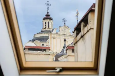 a picture of a building with a clock tower at Panoramic Loft - Lollo Luxury in Vilnius