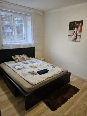 a bedroom with a bed in a room at Kauno apartamentai 1 bed room in Kaunas