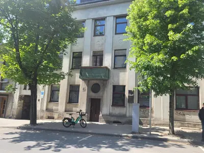 a bike parked in front of a building at Kauno apartamentai 1 bed room in Kaunas