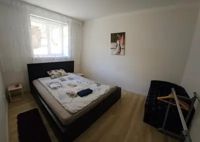 a bedroom with a bed and a window at Kauno apartamentai 1 bed room in Kaunas