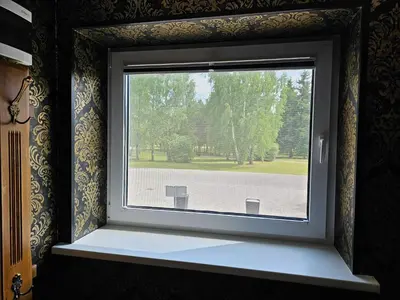 a window with a view of a park at Park apartments in Rokiškis