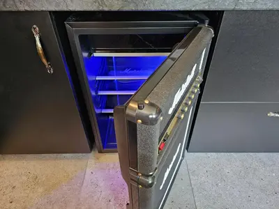 an empty refrigerator with its door open in a kitchen at Park apartments in Rokiškis