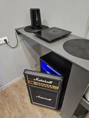 a desk with a laptop and a box under it at Park apartments in Rokiškis