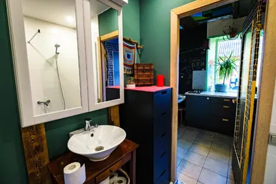 a bathroom with a sink and a mirror at Kabina in Pakruojis