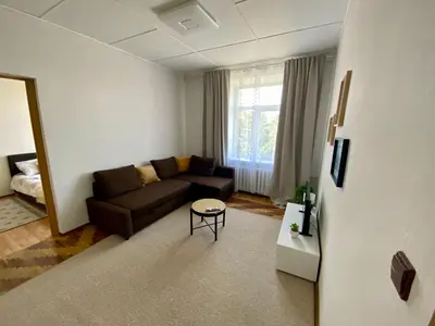a living room with a couch and a table at Oldtown castle view apartment in Kaunas